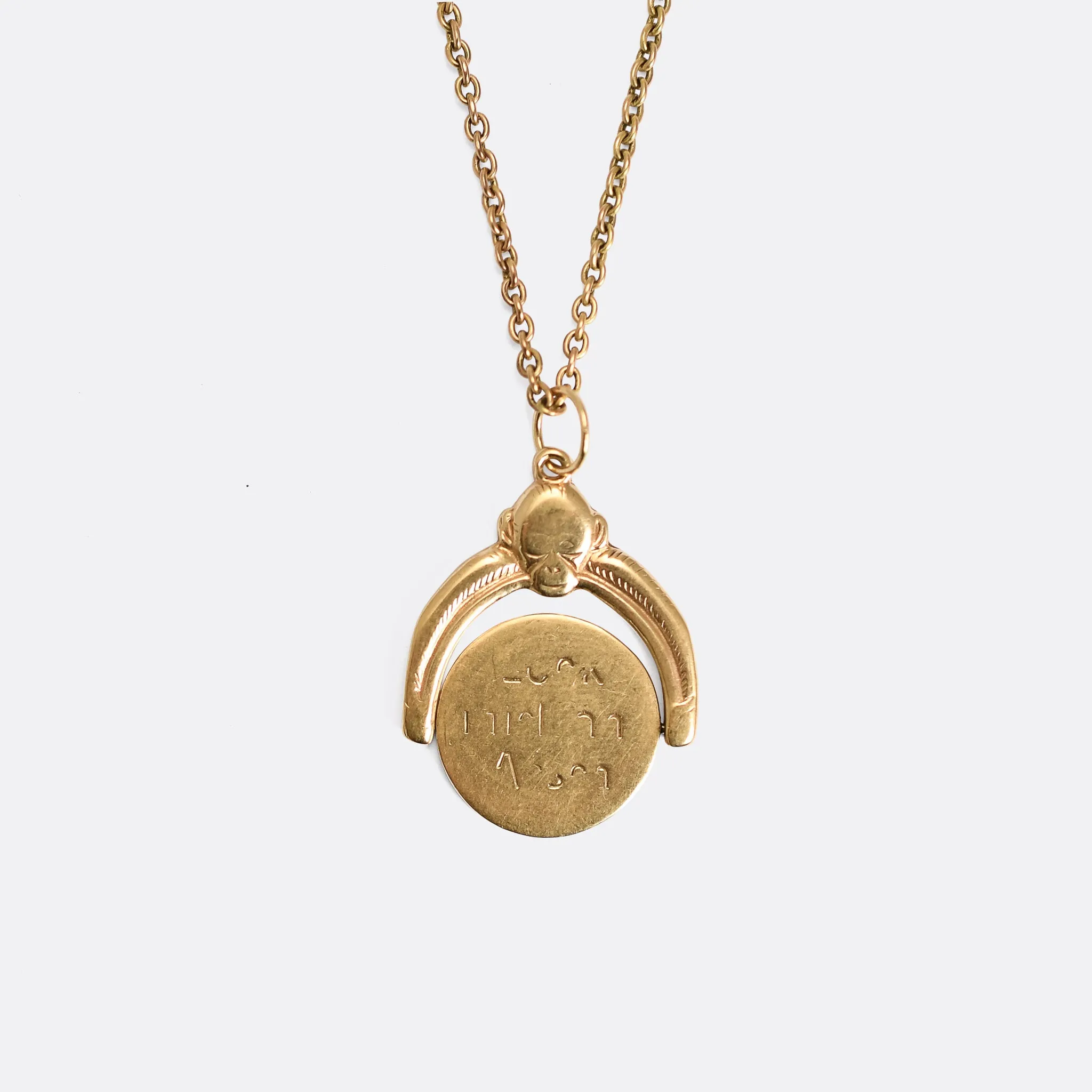 1950's Gold "Kiss My Ass" Spinner Pendant